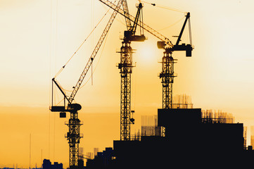 Silhouette City worker, construction crews to work on high ground heavy industry