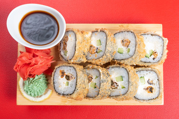 Baked roll breaded. with various fillings. With ginger and wasabi.