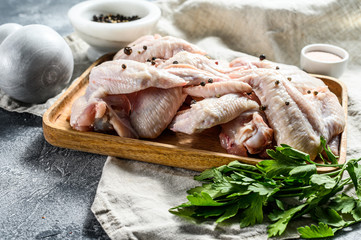 Raw Turkey wings. Farm organic poultry. Top view. Gray background
