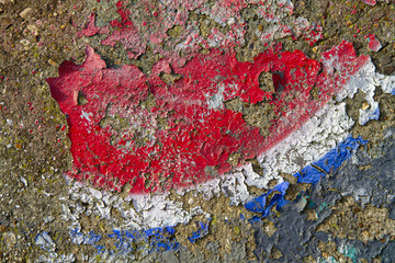 Closeup detail of old peeling graffiti