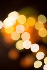 Bokeh background in orange and yellow colors in black background