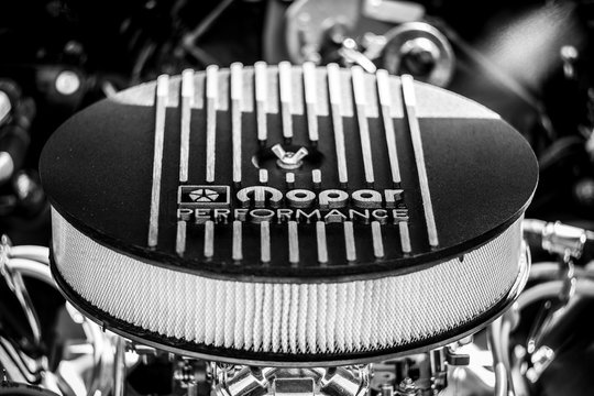 PAAREN IM GLIEN, GERMANY - MAY 19, 2018: Car part Mopar Performance. Mopar is the parts, service and customer care organization within Fiat Chrysler Automobiles. Black and white.