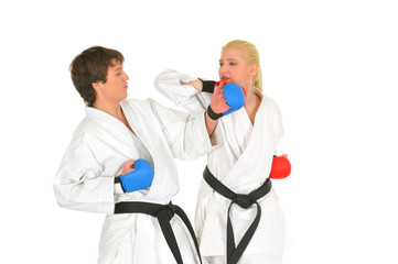 Young karateka students in white kimono
