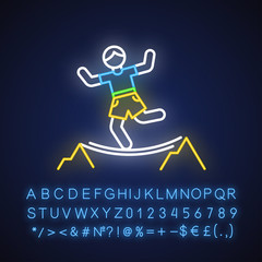 Highlining neon light icon. Slacklining. Walking and balancing on tightrope. Slackliner in mountains. Extreme sport stunt. Walker on rope. Glowing alphabet, numbers. Vector isolated illustration