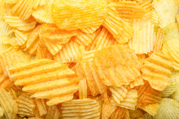 Many potato chips as background