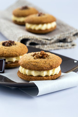 walnut sandwich cookies filled with butter cream