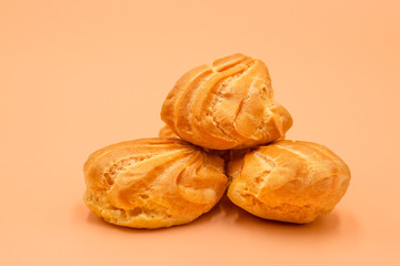 Profiteroles, close-up. Puffs cakes filled with pastry cream. Confectionery, eclair