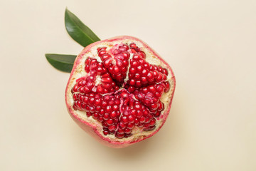 Ripe juicy pomegranate on light background