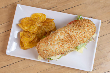 Sandwich with ham, cheese, vegetables and fried banana
