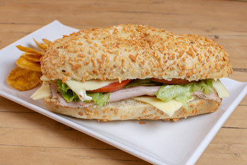 Sandwich with ham, cheese, vegetables and fried banana