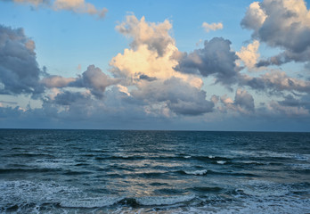 Landscape with Whitecap Waves and Billowy Sunlit Clouds  with a Blue Sky