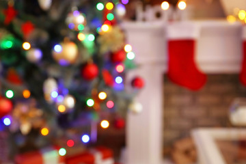 Beautiful decorated Christmas tree in room, blurred view