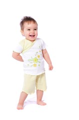 Happy baby girl in child wear bending down