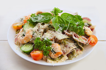 delicious delicious spaghetti with shrimps and basil on  plate