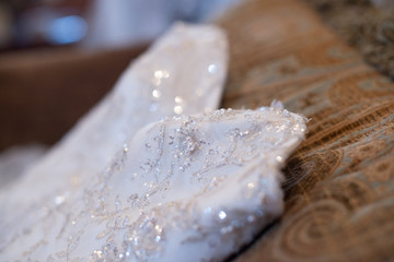 White wedding dress layed out close up