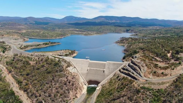 High angle aerial footage of Cotter Dam and Cotter reservoir, a supply source of potable water for the city of Canberra in the Australian Capital Territory, Australia. Low water levels due to drought.