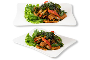 Isolated on White Background of Spicy Fillet Fish with Bell Pepper and Basil Leaf. Asian Food. Clipping Path Included