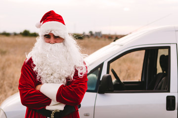 Santa Claus working as a delivery man at christmas