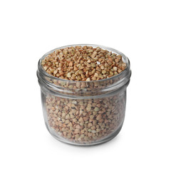 Organic green buckwheat in glass jar isolated on white