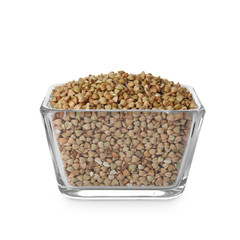 Organic green buckwheat in glass bowl isolated on white