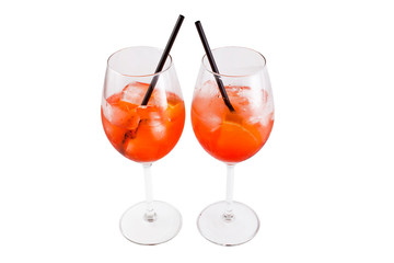 Two glass of aperol spritz cocktail isolated on a white background.