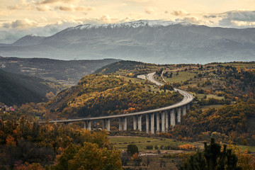 Curving alpine road in the mountains of Italy.