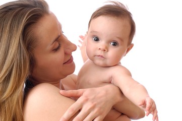 Mother hugging cute little newborn