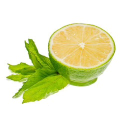 Fresh half of lime with mint leaves isolated on a white background