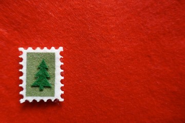 Christmas, Christmas motives, Christmas card.  Christmas tree on red felt. Background, Texture, Close-up
