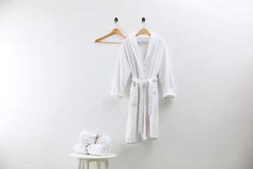 Soft comfortable bathrobe and fresh towels indoors