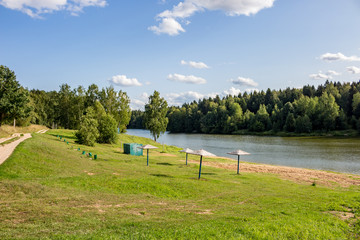 City beach on the banks of a picturesque pond. Stradalovka River, the city of Balabanovo, Russia