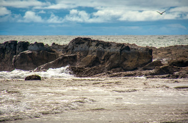 Fototapeta na wymiar Rocks in the sea at the coast