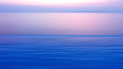 Motion blurred background of refraction in the sea
