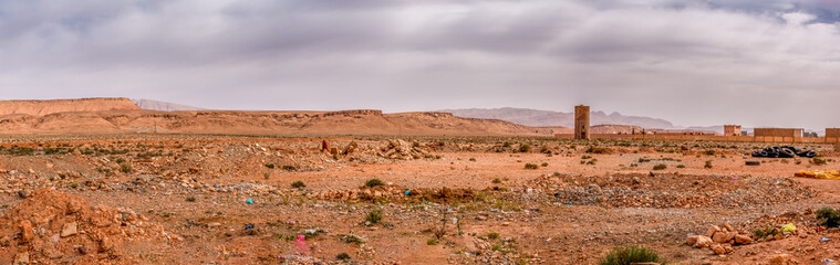 Panorama view of the desert near the city. Lots of garbage around. Concept of ecology problem.  Sunny day in Morocco.