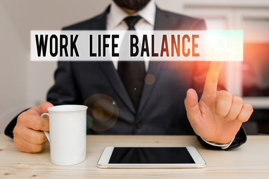 Text sign showing Work Life Balance. Business photo showcasing Division of time between working or family and leisure Male human wear formal clothes present presentation use hi tech smartphone