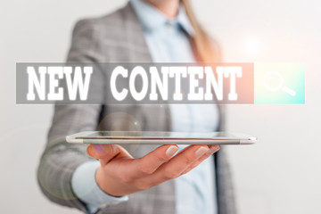 Writing note showing New Content. Business concept for fresh valuable and relevant information or...