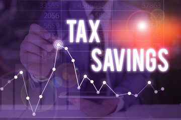 Handwriting text Tax Savings. Conceptual photo only a portion of income is taxable Pay a reduced...