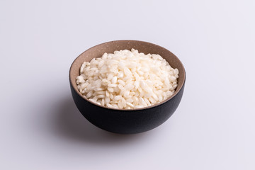 Italian Risotto rice on white background. Copy Space. Soft light. Latin term 