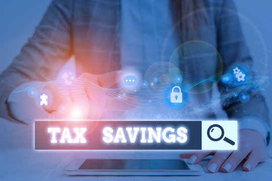 Conceptual hand writing showing Tax Savings. Concept meaning only a portion of income is taxable Pay a reduced amount of tax