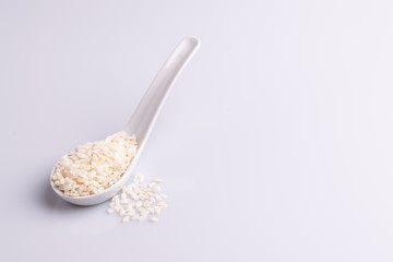 Italian Risotto rice on white background. Copy Space. Soft light. Latin term 