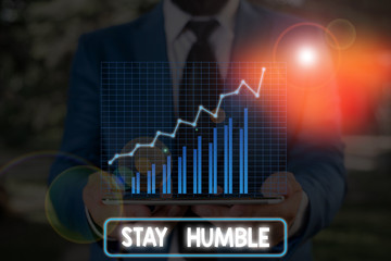Conceptual hand writing showing Stay Humble. Concept meaning not proud or arrogant Modest to be...