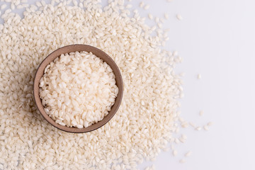 Italian Risotto rice on white background. Copy Space. Soft light. Latin term 