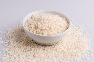 Italian Risotto rice on white background. Copy Space. Soft light. Latin term 