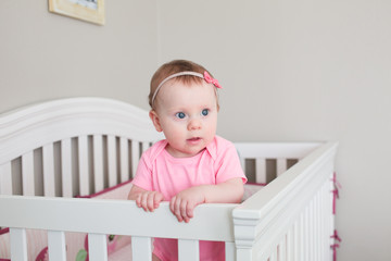 Close up Portrait of Cute 8 Month Old baby Girl with Big blue Eyes, Happy Baby Girl