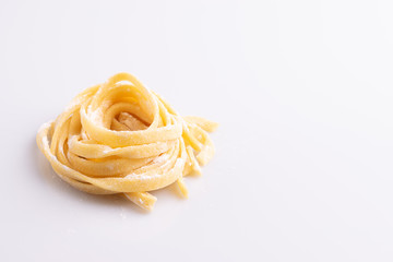 Home made pasta on white background, soft light, copy space