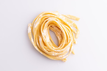 Home made pasta on white background, soft light, copy space