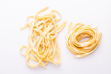 Home made pasta on white background, soft light, copy space