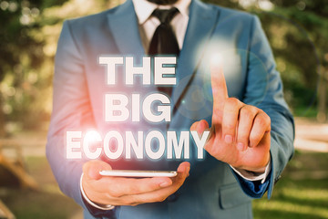 Conceptual hand writing showing The Big Economy. Concept meaning Global finances Worldwide Market...