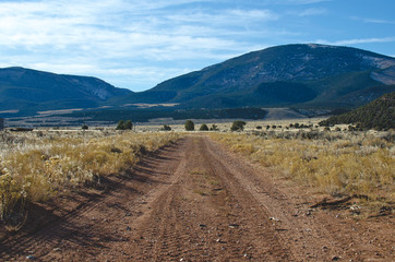 A long dirt road in the open countryside of the browns park area. 