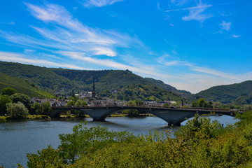 views of a village, a bridge and the rin river rhein in germany landscape sunny day